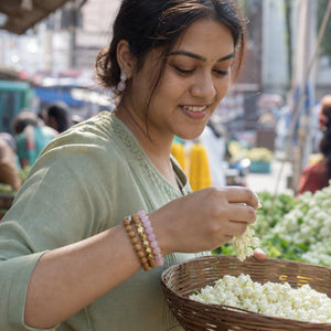 Rose Quartz and Rosewood Bracelet Stack Set of 3 worn by an Indian woman - candid lifestyle photograph