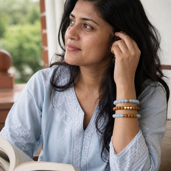 Aquamarine and Rosewood Bracelet Stack Set of 3 worn by an Indian woman - candid lifestyle photograph