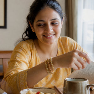 Citrine and Rosewood Bracelet Stack Set of 3 worn by an Indian woman - candid lifestyle photograph