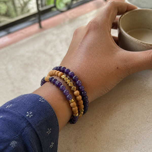 Amethyst and Rosewood Bracelet Stack Set of 3 on an Indian womans wrist - realistic close-up lifestyle photo
