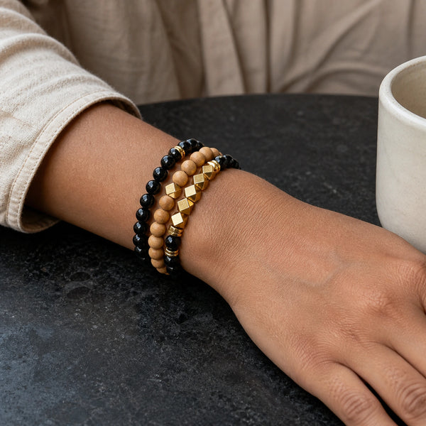 Black Onyx and Rosewood Bracelet Stack Set of 3 on an Indian womans wrist - realistic close-up lifestyle photo