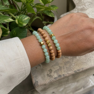 Green Aventurine and Rosewood Bracelet Stack Set of 3 on an Indian womans wrist - realistic close-up lifestyle photo