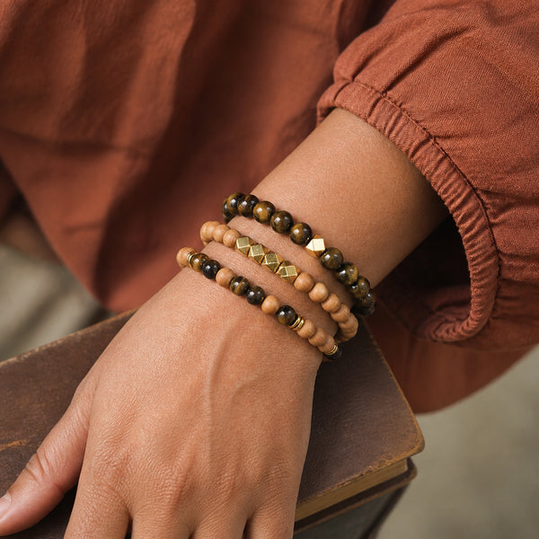 Tiger Eye and Rosewood Bracelet Stack Set of 3 on an Indian womans wrist - realistic close-up lifestyle photo