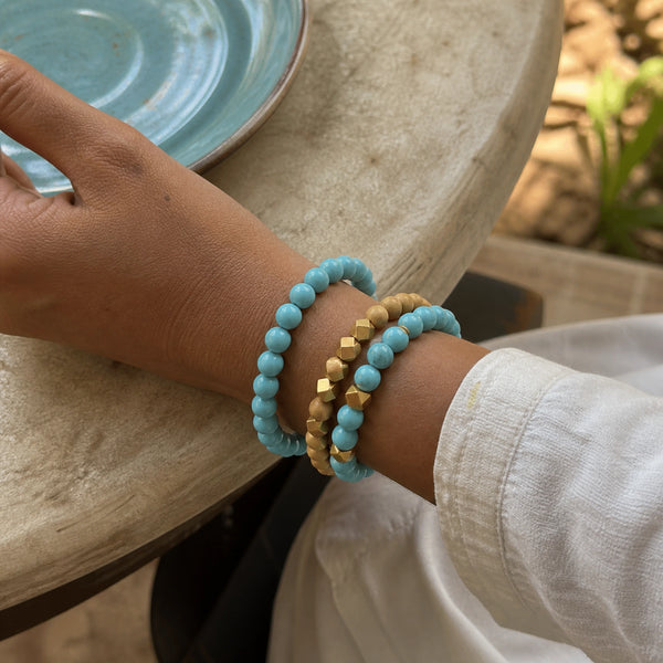 Turquoise and Rosewood Bracelet Stack Set of 3 on an Indian womans wrist - realistic close-up lifestyle photo