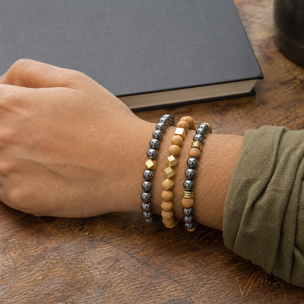 Hematite and Rosewood Bracelet Stack Set of 3 on an Indian womans wrist - realistic close-up lifestyle photo