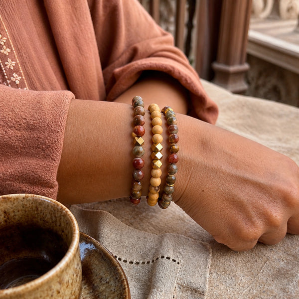 Picasso Jasper and Rosewood Bracelet Stack Set of 3 on an Indian woman's wrist - natural lifestyle photo