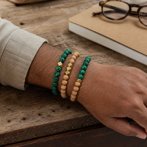 Malachite and Rosewood Bracelet Stack Set of 3 on an Indian mans wrist - realistic close-up lifestyle photo