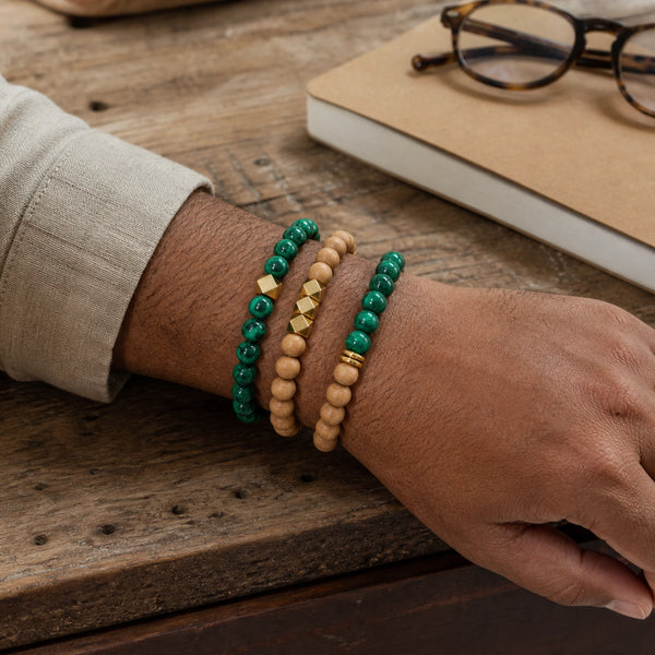 Malachite and Rosewood Bracelet Stack Set of 3 on an Indian mans wrist - realistic close-up lifestyle photo