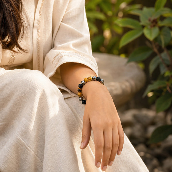 The Quadruple Protection Bracelet 8mm worn on woman's wrist outdoors