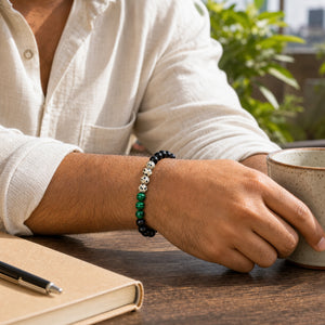 Dalmatian Jasper Bracelet 8mm worn on man's wrist outdoors