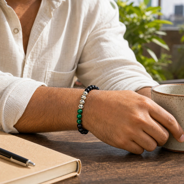Dalmatian Jasper Bracelet 8mm worn on man's wrist outdoors