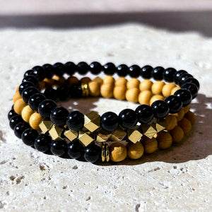 Black Onyx and Rosewood 6 mm bracelet stack with gold-tone accents - macro bead detail