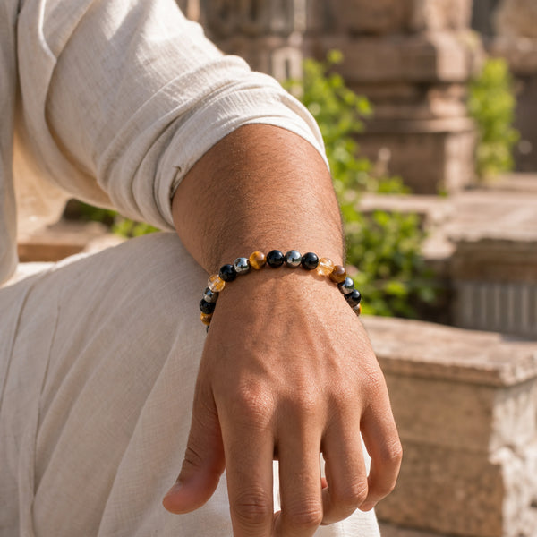 The Quadruple Protection Bracelet 8mm worn on man's wrist outdoors