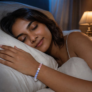 Woman sleeping peacefully while wearing the Soultheory Deep Sleep Bracelet