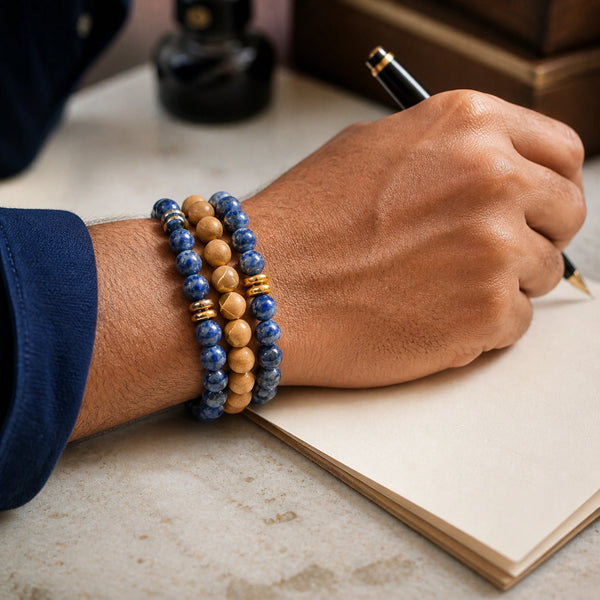 Lapis Lazuli and Rosewood Bracelet Stack Set of 3 on an Indian man's wrist - writing desk lifestyle photo