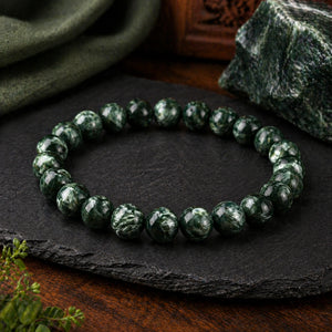 Seraphinite Bracelet 8mm product angle on dark stone