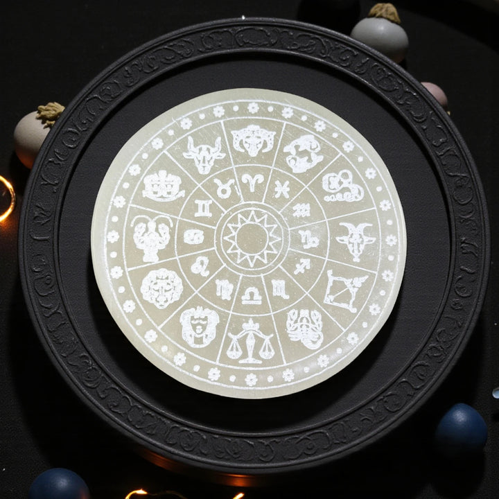 Round selenite charging plate engraved with zodiac wheel for cleansing and recharging crystal bracelets