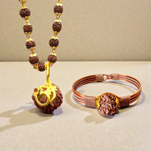 Om Sree energy mala with gold Om pendant beside a Nepali copper rudraksha bracelet