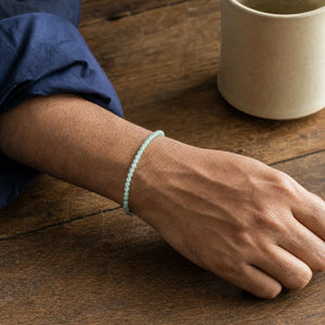 Man wearing the Aventurine 4mm Round Bead Bracelet with a navy cotton shirt