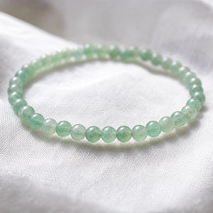 Close-up of the Aventurine 4mm Round Bead Bracelet on white linen