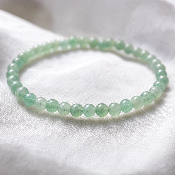 Close-up of the Aventurine 4mm Round Bead Bracelet on white linen