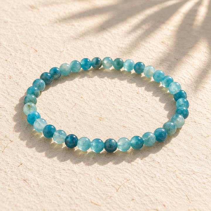 Soultheory Blue Apatite 4mm Round Bead Bracelet on cream handmade paper