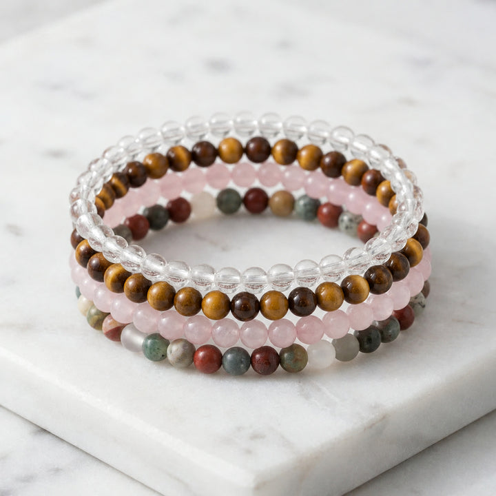 Libra Zodiac Energy Stone Stack of 4 Bracelet - Tiger Eye, Bloodstone, Rose Quartz and Clear Quartz on white marble