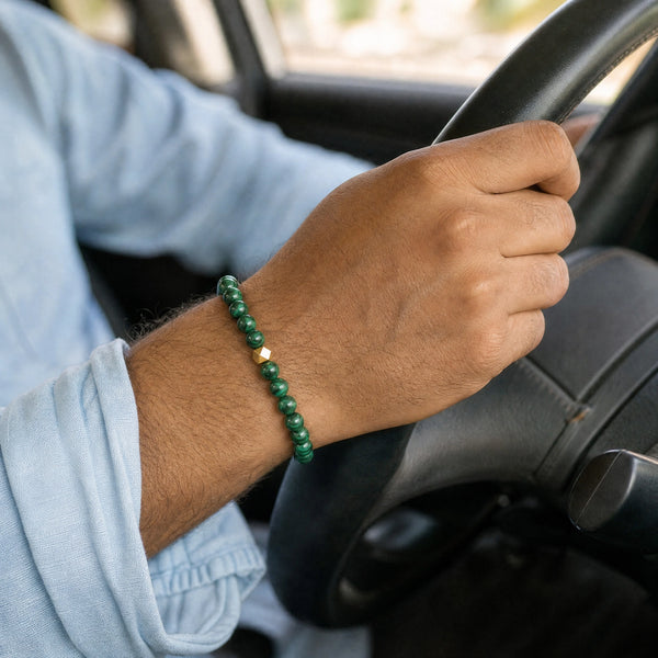 Man wearing the Malachite bracelet, while driving