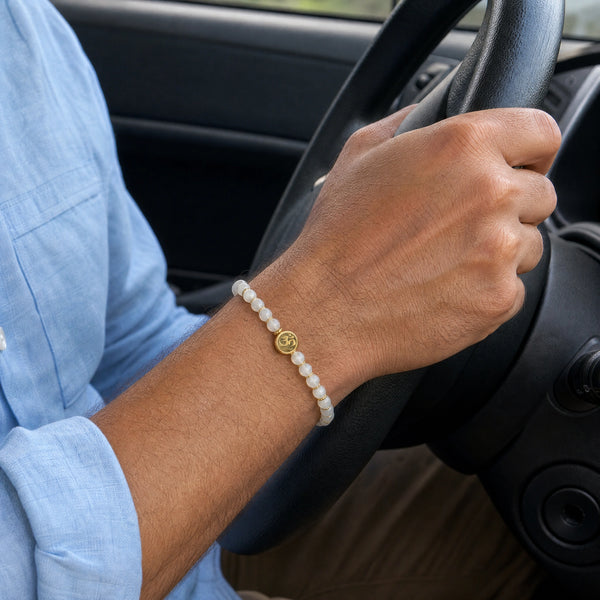 Man wearing the Moonstone bracelet, while driving