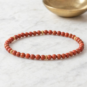 Soultheory Red Jasper 4mm Bead Bracelet with Gold Spacers on white marble