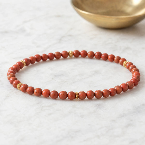 Soultheory Red Jasper 4mm Bead Bracelet with Gold Spacers on white marble