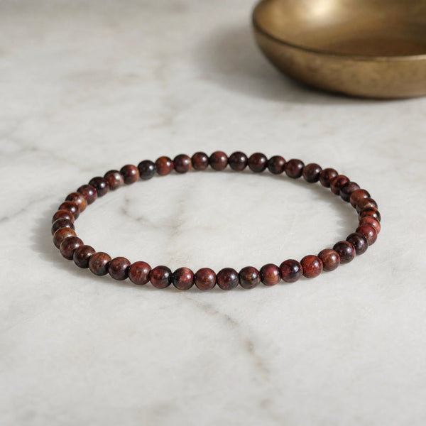 Soultheory Red Tiger Eye 4mm Round Bead Bracelet on white marble