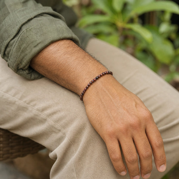 Man wearing the Red Tiger Eye 4mm Round Bead Bracelet with an olive linen shirt