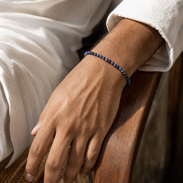 Man wearing the Sodalite 4mm Round Bead Bracelet with a white kurta