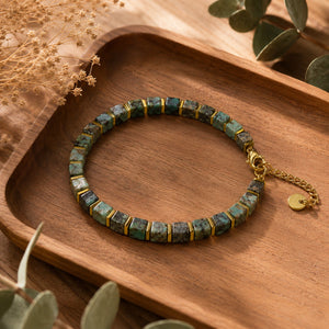 African turquoise bracelet flat lay on a wooden tray with eucalyptus leaves - Soultheory