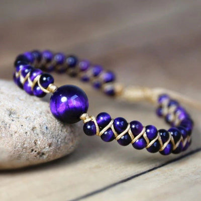 Amethyst cosmic eclipse bracelet with gold cord wrap and a large centre bead for calm - Soultheory India