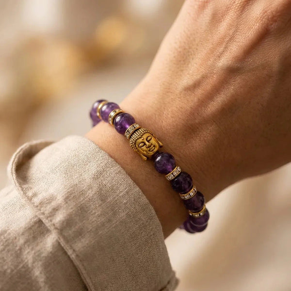 Amethyst Buddha bracelet worn on the wrist with gold charm and crystal spacers for daily calm