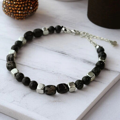 Black onyx stainless steel bracelet with silver cube beads for protection and strength - Soultheory India