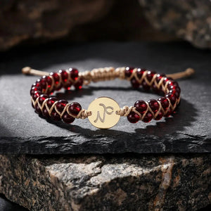 Capricorn zodiac energy stone bracelet with gold sign charm and deep red garnet beads for ambition - Soultheory India