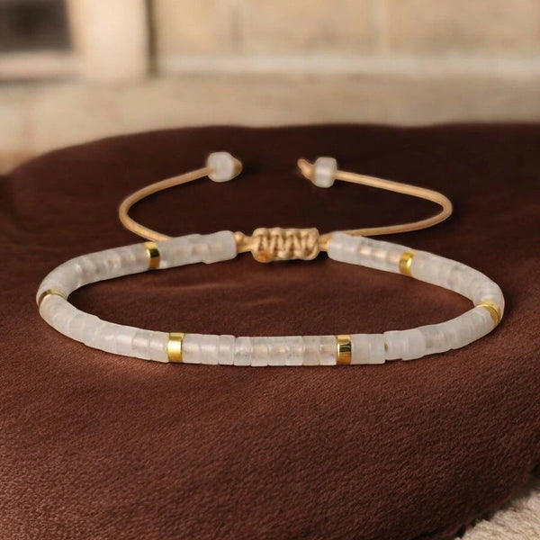 Clear quartz heishi bracelet with gold accents and adjustable cord for mental clarity