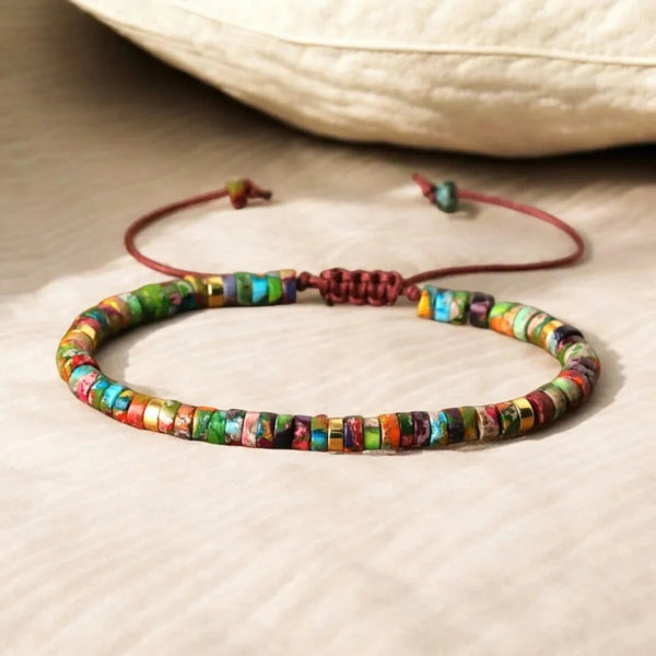Close-up of colourful multi imperial jasper beads with gold accents on the his and hers bracelet