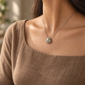 Dalmatian Fine Cord Necklace - natural side-angle model photograph