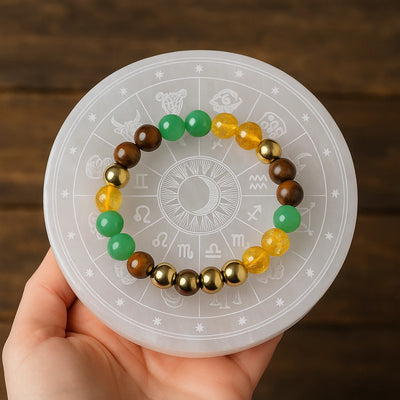 Dhan Yog money magnet bracelet on a zodiac selenite plate for wealth - Soultheory India