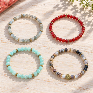 Soultheory Healthy 4 mm bracelet stack with Labradorite, Carnelian - four bracelets on a sunlit table