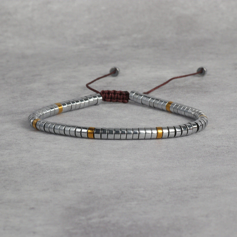 Natural hematite bracelet with silver and gold disc beads for grounding - Soultheory India