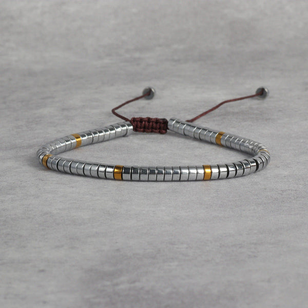 Natural hematite bracelet with silver and gold disc beads for grounding - Soultheory India