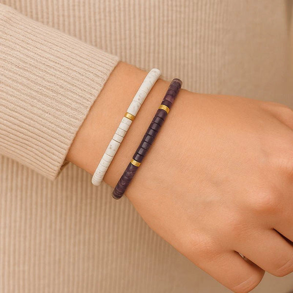 White howlite and purple amethyst bracelets stacked on wrist for calm and emotional balance