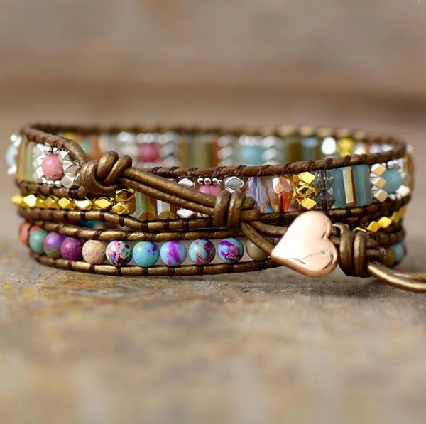 Close-up of the imperial jasper wrap bracelet showing gemstone rows and a rose gold heart button
