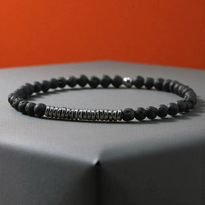 Black lava rock bracelet with silver hematite disc spacers for grounding and daily stability
