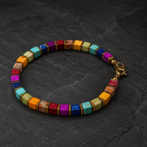 Multi imperial jasper bracelet with golden hematite spacers, Soultheory flat lay on dark slate stone